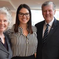 An alumna with Thomas and Marcia Haas